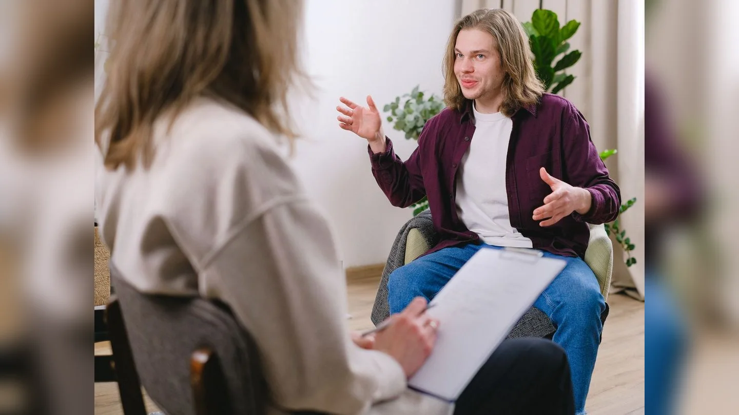 Two people talking during a consultation